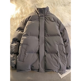 A men's puffer jacket featuring a mock neck design, crafted from durable, insulated material to provide warmth and comfort during winter. Its stylish appearance combines functionality 1
