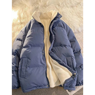 A men's puffer jacket featuring a mock neck design, crafted from durable, warm material, perfect for winter. Its stylish silhouette combines functionality with a modern 3